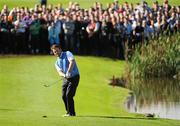 4 October 2010; Graeme McDowell, Team Europe, pitches onto the 14th green during his singles match against Hunter Mahan, Team USA. The 2010 Ryder Cup, The Celtic Manor Resort, City of Newport, Wales. Picture credit: Matt Browne / SPORTSFILE