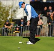 4 October 2010; Rory Mcllroy, Team Europe, watches his par putt on the 18th green go into the hole to half his singles match against Stewart Cink, Team USA. The 2010 Ryder Cup, The Celtic Manor Resort, City of Newport, Wales. Picture credit: Matt Browne / SPORTSFILE