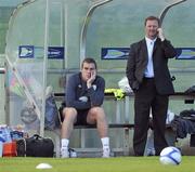 5 October 2010; Republic of Ireland's Richard Dunne, alongside team security officer Tony Hickey, sits out squad training ahead of their EURO 2012 Championship Group B Qualifier against Russia on Friday. Republic of Ireland Squad Training, Gannon Park, Malahide, Co. Dublin. Picture credit: David Maher / SPORTSFILE