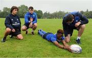 3 August 2016; Leinster's Conor O'Brien, second left, and James Ryan, right, coach participants Tomas Santiago, left, and Daryl Olaniyi during a Leinster Rugby School of Excellence Camp at King's Hospital School in Palmerstown, Dublin. Photo by Seb Daly/Sportsfile