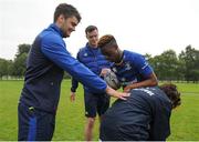 3 August 2016; Leinster's Conor O'Brien, left, and James Ryan, behind, coach participants Tomas Santiago, right, and Daryl Olaniyi during a Leinster Rugby School of Excellence Camp at King's Hospital School in Palmerstown, Dublin. Photo by Seb Daly/Sportsfile