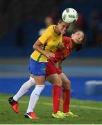 3 August 2016; Tamires of Brazil in action against Li Yang of China during the Women's Football first round Group E match between Brazil and China on Day -2 of the Rio 2016 Olympic Games  at the Olympic Stadium in Rio de Janeiro, Brazil. Photo by Stephen McCarthy/Sportsfile