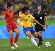 3 August 2016; Beatriz of Brazil in action against Haiyan Wu of China during the Women's Football first round Group E match between Brazil and China on Day -2 of the Rio 2016 Olympic Games  at the Olympic Stadium in Rio de Janeiro, Brazil. Photo by Stephen McCarthy/Sportsfile