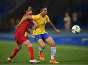 3 August 2016; Beatriz of Brazil in action against Ruyin Tan of China during the Women's Football first round Group E match between Brazil and China on Day -2 of the Rio 2016 Olympic Games  at the Olympic Stadium in Rio de Janeiro, Brazil. Photo by Stephen McCarthy/Sportsfile