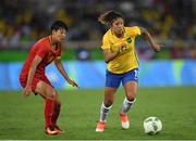3 August 2016; Cristiane of Brazil in action against Dongna Li of China during the Women's Football first round Group E match between Brazil and China on Day -2 of the Rio 2016 Olympic Games  at the Olympic Stadium in Rio de Janeiro, Brazil. Photo by Stephen McCarthy/Sportsfile