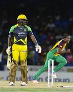 3 August 2016; Chris Gayle (L) of Jamaica Tallawahs bowled by Christopher Barnwell (R) of Guyana Amazon Warriors during the Hero Caribbean Premier League match between Guyana Amazon Warriors and Jamaica Tallawahs - Hero Caribbean Premier League (CPL) – Play-off - Match 31 at Warner Park in Basseterre, St Kitts. Photo by Randy Brooks/Sportsfile