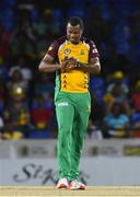 3 August 2016; Christopher Barnwell of Guyana Amazon Warriors examines his finger after hit by the ball struck by Chris Gayle of Jamaica Tallawahs during the Hero Caribbean Premier League match between Guyana Amazon Warriors and Jamaica Tallawahs - Hero Caribbean Premier League (CPL) – Play-off - Match 31 at Warner Park in Basseterre, St Kitts. Photo by Randy Brooks/Sportsfile