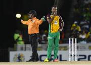 3 August 2016; Umpire John Ward (L) signals the 5th wide in one over from Veerasammy Permaul (R) of Guyana Amazon Warriors of Jamaica Tallawahs during the Hero Caribbean Premier League match between Guyana Amazon Warriors and Jamaica Tallawahs - Hero Caribbean Premier League (CPL) – Play-off - Match 31 at Warner Park in Basseterre, St Kitts. Photo by Randy Brooks/Sportsfile