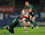 8 October 2010; Paddy Wallace, Ulster, is tackled by Rodd Penney, left, and Ludovic Mercier, Aironi Rugby. Heineken Cup Pool 4, Round 1, Ulster v Aironi Rugby, Ravenhill Park, Belfast, Co. Antrim. Photo by Sportsfile