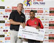 4 August 2016;  Sunil Narine of Trinbago Knight Riders receives the player of the match prize on behalf of Brendon McCullum from Tom Moody CPL Commercial Director of at the end of the Hero Caribbean Premier League (CPL) – Play-off - Match 32 between St. Lucia Zouks and Trinbago Knight Riders at Warner Park in Basseterre, St Kitts. Photo by Randy Brooks/Sportsfile
