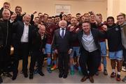 5 August 2016; The President of Ireland Michael D. Higgins with the Galway United team and staff in their dressing room after defeating Dundalk during the SSE Airtricity League Premier Division match between Galway United and Dundalk at Eamonn Deasy Park in Galway. Photo by David Maher/Sportsfile