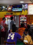 5 August 2016; Customers in a local diner watch on as the opening ceremony of the 2016 Rio Summer Olympic Games is played on a TV screen in Rio de Janeiro, Brazil. Photo by Stephen McCarthy/Sportsfile