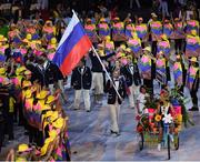 5 August 2016; Flagbearer Sergey Tetyukhin of Russia leads his team during the parade of nations at the opening ceremony of the 2016 Rio Summer Olympic Games at the Maracanã Stadium in Rio de Janeiro, Brazil. Photo by Ramsey Cardy/Sportsfile