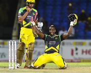 5 August 2016;  Andre Russell (R) of Jamaica Tallawahs celebrates his century as teammate Jonathan Foo (L) looks on during the Hero Caribbean Premier League (CPL) – Play-off - Match 33 at Warner Park in Basseterre, St Kitts. Photo by Randy Brooks/Sportsfile