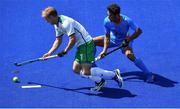 6 August 2016; Michael Watt of Ireland in action against Kothajit Khadangbam of India during their Pool B match at the Olympic Hockey Centre, Deodoro, during the 2016 Rio Summer Olympic Games in Rio de Janeiro, Brazil. Photo by Brendan Moran/Sportsfile