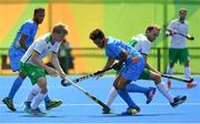 6 August 2016; Kirk Shimmins of Ireland in action against Kothajit Khadangbam of India during their Pool B match at the Olympic Hockey Centre, Deodoro, during the 2016 Rio Summer Olympic Games in Rio de Janeiro, Brazil. Photo by Brendan Moran/Sportsfile