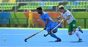6 August 2016; Manpreet Singh of India in action against Kirk Shimmins of Ireland during their Pool B match at the Olympic Hockey Centre, Deodoro, during the 2016 Rio Summer Olympic Games in Rio de Janeiro, Brazil. Photo by Brendan Moran/Sportsfile
