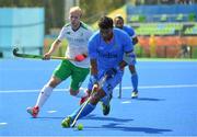 6 August 2016; Raghunath Vokkaliga of India in action against Eugene Magee of Ireland during their Pool B match at the Olympic Hockey Centre, Deodoro, during the 2016 Rio Summer Olympic Games in Rio de Janeiro, Brazil. Photo by Brendan Moran/Sportsfile