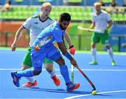 6 August 2016; Manpreet Singh of India in action against Eugene Magee of Ireland during their Pool B match at the Olympic Hockey Centre, Deodoro, during the 2016 Rio Summer Olympic Games in Rio de Janeiro, Brazil. Photo by Brendan Moran/Sportsfile