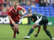 9 October 2010; Keith Earls, Munster, in action against Elvis Seveali'i, London Irish. Heineken Cup, Pool 3 Round 1, London Irish v Munster, Madejski Stadium, Reading, England. Picture credit: Matthew Impey / SPORTSFILE