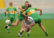 10 October 2010; Tony Dalton, Clara, in action against Shane Sullivan, left, and Roy Malone, Rhode. Offaly County Senior Football Championship Final, Rhode v Clara, O'Connor Park, Tullamore, Co. Offaly. Photo by Sportsfile
