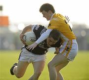 10 October 2010; James Hand, Magheracloone, in action against Colin Duffy, Clontibret. Monaghan County Senior Football Championship Final, Clontibret v Magheracloone, Inniskeen, Co. Monaghan. Picture credit: Oliver McVeigh / SPORTSFILE
