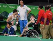 6 August 2016; Kieran Behan of Ireland is led away in a wheelchair after suffering a suspected dislocated left knee during the Men's Artistic Gymnastics Qualification in the Rio Olympic Arena, Barra de Tijuca, during the 2016 Rio Summer Olympic Games in Rio de Janeiro, Brazil. Photo by Brendan Moran/Sportsfile