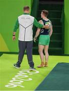 6 August 2016; Kieran Behan of Ireland is helped from the field of play after suffering a suspected dislocated left knee during the Men's Artistic Gymnastics Qualification in the Rio Olympic Arena, Barra de Tijuca, during the 2016 Rio Summer Olympic Games in Rio de Janeiro, Brazil. Photo by Brendan Moran/Sportsfile