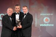15 October 2010; Peter Kelly, Kildare, is presented with his GAA Football All-Star award by Uachtarán Chumann Lúthchleas Gael Criostóir Ó Cuana and Jeroen Hoencamp, CEO, Vodafone Ireland, during the 2010 GAA All-Stars Awards, sponsored by Vodafone. Citywest Hotel & Conference Centre, Saggart, Co. Dublin. Picture credit: Brendan Moran / SPORTSFILE