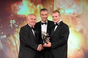 15 October 2010; Peter Kelly, Kildare, is presented with his GAA Football All-Star award by Uachtarán Chumann Lúthchleas Gael Criostóir Ó Cuana and Jeroen Hoencamp, CEO, Vodafone Ireland, during the 2010 GAA All-Stars Awards, sponsored by Vodafone. Citywest Hotel & Conference Centre, Saggart, Co. Dublin. Picture credit: Brendan Moran / SPORTSFILE