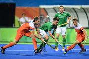 7 August 2016; Jonathan Bell of Ireland in action against Bob de Voogd, left, and Jorrit Croon of Netherlands during their Pool B match at the Olympic Hockey Centre, Deodoro, during the 2016 Rio Summer Olympic Games in Rio de Janeiro, Brazil. Picture by Brendan Moran/Sportsfile