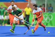 7 August 2016; Michael Watt of Ireland in action against Sander Baart of Netherlands during their Pool B match at the Olympic Hockey Centre, Deodoro, during the 2016 Rio Summer Olympic Games in Rio de Janeiro, Brazil. Picture by Brendan Moran/Sportsfile