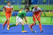 7 August 2016; Shane O'Donoghue of Ireland in action against Billy Bakker of Netherlands during their Pool B match at the Olympic Hockey Centre, Deodoro, during the 2016 Rio Summer Olympic Games in Rio de Janeiro, Brazil. Picture by Brendan Moran/Sportsfile