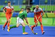 7 August 2016; Shane O'Donoghue of Ireland in action against Billy Bakker of Netherlands during their Pool B match at the Olympic Hockey Centre, Deodoro, during the 2016 Rio Summer Olympic Games in Rio de Janeiro, Brazil. Picture by Brendan Moran/Sportsfile