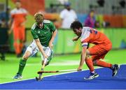 7 August 2016; Kirk Shimmins of Ireland in action against Robert van der Horst of Netherlands during their Pool B match at the Olympic Hockey Centre, Deodoro, during the 2016 Rio Summer Olympic Games in Rio de Janeiro, Brazil. Picture by Brendan Moran/Sportsfile