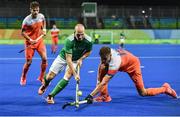 7 August 2016; Peter Caruth of Ireland in action against Sander de Wijn of Netherlands of Netherlands during their Pool B match at the Olympic Hockey Centre, Deodoro, during the 2016 Rio Summer Olympic Games in Rio de Janeiro, Brazil. Picture by Brendan Moran/Sportsfile