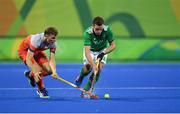 7 August 2016; Jonathan Bell of Ireland in action against Jorrit Croon of Netherlands during their Pool B match at the Olympic Hockey Centre, Deodoro, during the 2016 Rio Summer Olympic Games in Rio de Janeiro, Brazil. Picture by Brendan Moran/Sportsfile