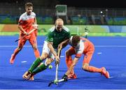 7 August 2016; Peter Caruth of Ireland in action against Sander de Wijn of Netherlands during their Pool B match at the Olympic Hockey Centre, Deodoro, during the 2016 Rio Summer Olympic Games in Rio de Janeiro, Brazil. Photo by Brendan Moran/Sportsfile