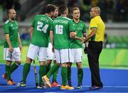 7 August 2016; Ireland players speak to umpire Nathan Stagno after their Pool B match against the Netherlands at the Olympic Hockey Centre, Deodoro, during the 2016 Rio Summer Olympic Games in Rio de Janeiro, Brazil. Photo by Brendan Moran/Sportsfile