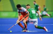 7 August 2016; Robert van der Horst of Netherlands in action against Alan Sothern of Ireland during their Pool B match at the Olympic Hockey Centre, Deodoro, during the 2016 Rio Summer Olympic Games in Rio de Janeiro, Brazil. Photo by Brendan Moran/Sportsfile