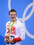 7 August 2016; Adam Peaty of Great Britain with his gold medal after winning the final of the Men's 100m Breaststroke at the Olympic Aquatic Stadium during the 2016 Rio Summer Olympic Games in Rio de Janeiro, Brazil. Photo by Stephen McCarthy/Sportsfile