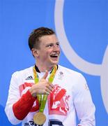 7 August 2016; Adam Peaty of Great Britain with his gold medal after winning the final of the Men's 100m Breaststroke at the Olympic Aquatic Stadium during the 2016 Rio Summer Olympic Games in Rio de Janeiro, Brazil. Photo by Stephen McCarthy/Sportsfile
