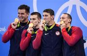 7 August 2016; Team USA, from left, Nathan Adrian, Ryan Held, Michael Phelps and Caeleb Dressel with their gold medals after they won the Men's 4 x 100m Freestyle Relay at the Olympic Aquatic Stadium during the 2016 Rio Summer Olympic Games in Rio de Janeiro, Brazil. Photo by Stephen McCarthy/Sportsfile