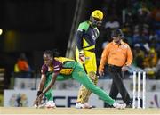 7 August 2016;  Steven Jacobs (L) of Guyana Amazon Warriors stops the ball as Chris Gayle of Jamaica Tallawahs watch during Match 34 of the Hero Caribbean Premier League (CPL) – Final at Warner Park in Basseterre, St Kitts. Photo by Randy Brooks/Sportsfile