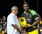 7 August 2016;   Andre Russell (R) of Jamaica Tallawahs receives El Dorado Celebration from Mr. Komal Samaroo (L) Chairman, El Dorado at the end of Match 34 of the Hero Caribbean Premier League (CPL) – Final at Warner Park in Basseterre, St Kitts. Photo by Randy Brooks/Sportsfile