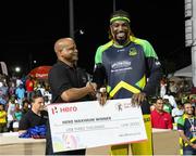 7 August 2016;   Chris Gayle (R) of Jamaica Tallawahs receives HERO Maximum from the Honourable Lindsay Grant (L) Minister of Tourism at the end of Match 34 of the Hero Caribbean Premier League (CPL) – Final at Warner Park in Basseterre, St Kitts. Photo by Randy Brooks/Sportsfile