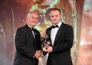 15 October 2010; Benny Coulter, Down, is presented with his GAA Football All-Star award by Uachtarán Chumann Lúthchleas Gael Criostóir Ó Cuana during the 2010 GAA All-Stars Awards, sponsored by Vodafone. Citywest Hotel & Conference Centre, Saggart, Co. Dublin. Picture credit: Brendan Moran / SPORTSFILE