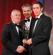 15 October 2010; Michael Fennelly, Kilkenny, is presented with his GAA Hurling All-Star award by Uachtarán Chumann Lúthchleas Gael Criostóir Ó Cuana and Jeroen Hoencamp, CEO, Vodafone Ireland, during the 2010 GAA All-Stars Awards, sponsored by Vodafone. Citywest Hotel & Conference Centre, Saggart, Co. Dublin. Picture credit: Brendan Moran / SPORTSFILE