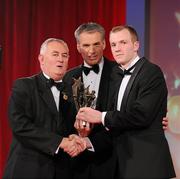 15 October 2010; Lar Corbett, Tipperary, is presented with his GAA Hurling All-Star award by Uachtarán Chumann Lúthchleas Gael Criostóir Ó Cuana and Jeroen Hoencamp, CEO, Vodafone Ireland, during the 2010 GAA All-Stars Awards, sponsored by Vodafone. Citywest Hotel & Conference Centre, Saggart, Co. Dublin. Picture credit: Brendan Moran / SPORTSFILE