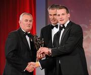 15 October 2010; Jackie Tyrrell, Kilkenny, is presented with his GAA Hurling All-Star award by Uachtarán Chumann Lúthchleas Gael Criostóir Ó Cuana and Jeroen Hoencamp, CEO, Vodafone Ireland, during the 2010 GAA All-Stars Awards, sponsored by Vodafone. Citywest Hotel & Conference Centre, Saggart, Co. Dublin. Picture credit: Brendan Moran / SPORTSFILE